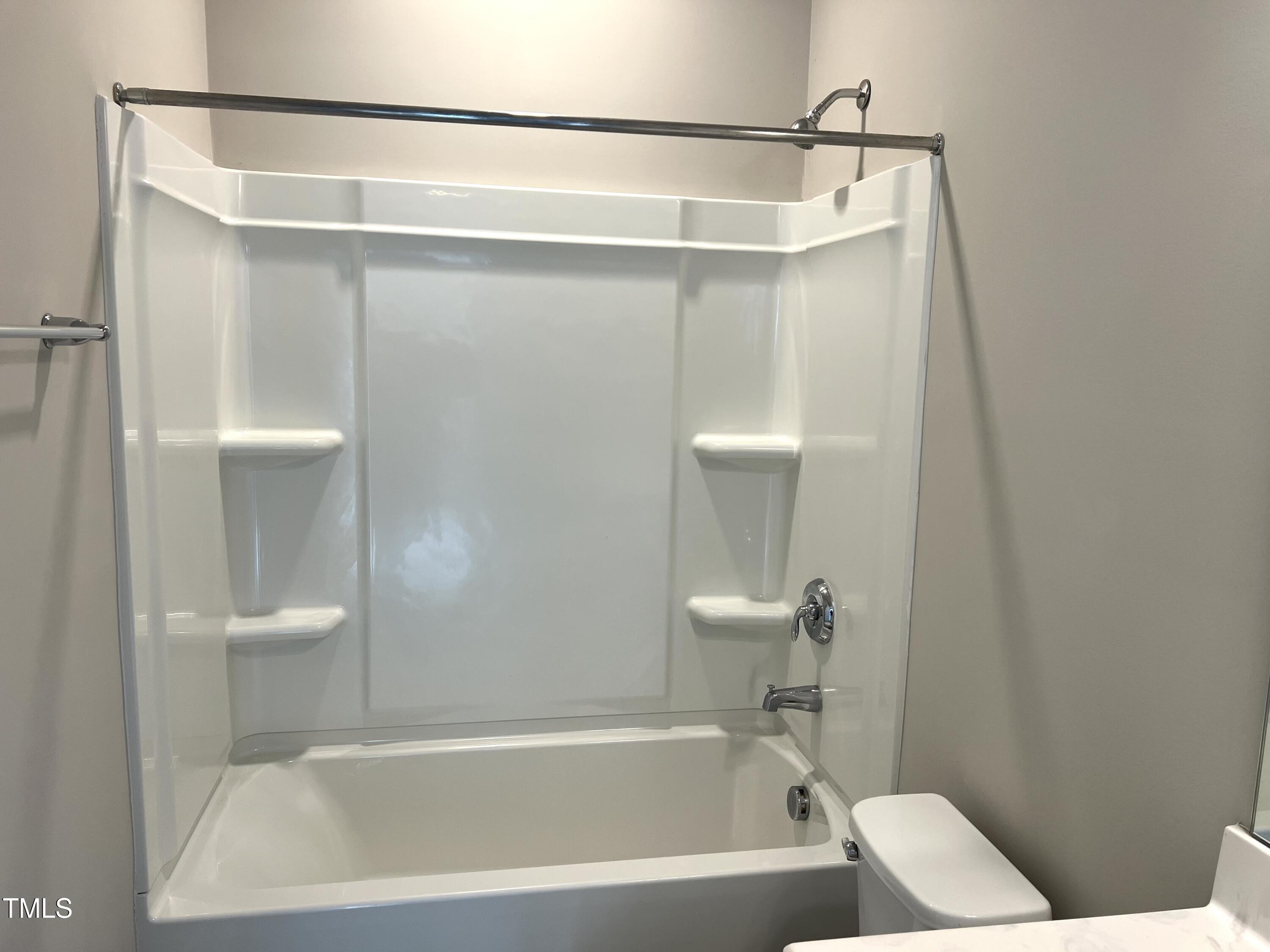 10530 Sablewood Drive, Unit 113 Raleigh, NC 27617 - Photo 49 of 61 a bathroom with a shower and a bath tub