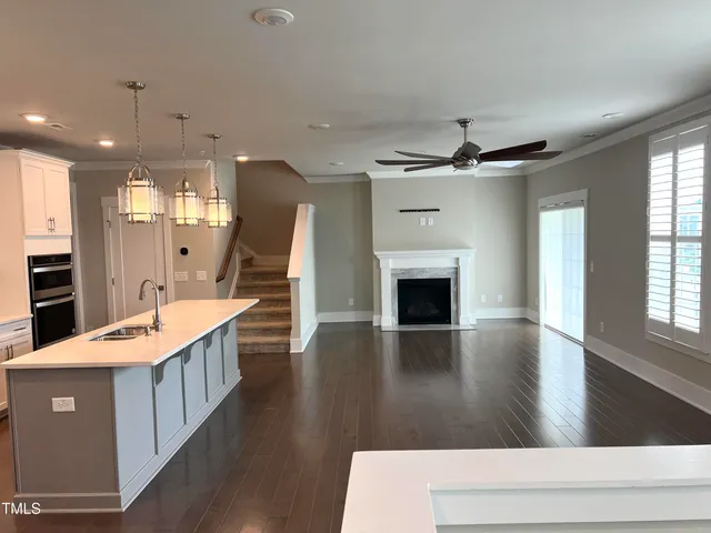a kitchen with sink a microwave and stove