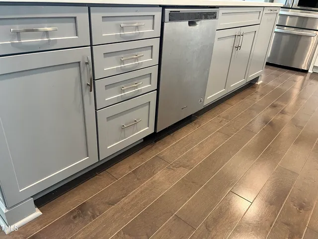 a view of a kitchen with white wall