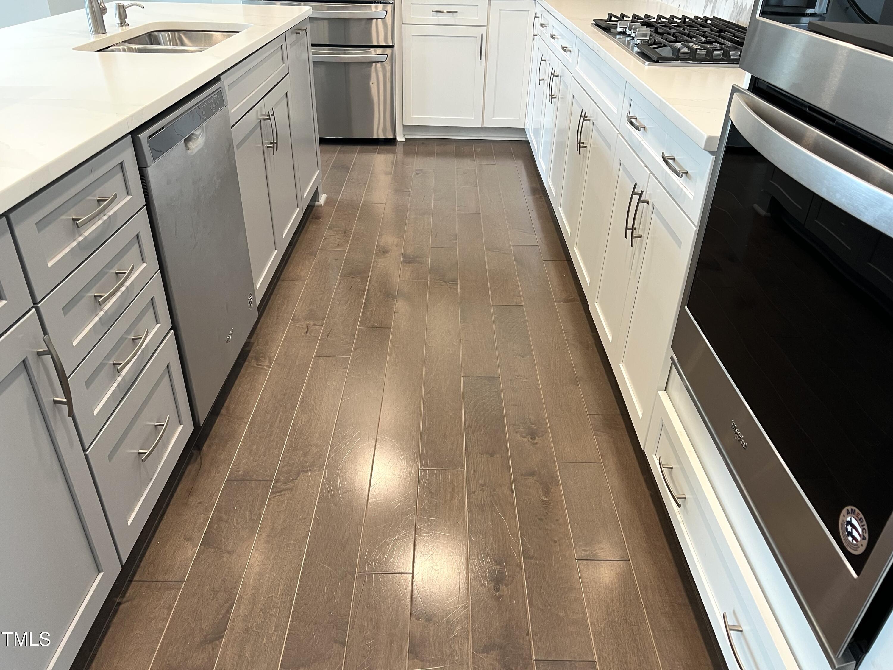 10530 Sablewood Drive, Unit 113 Raleigh, NC 27617 - Photo 10 of 61 a kitchen with sink a microwave and stove