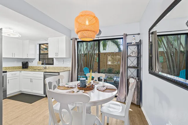a kitchen with a sink appliances and cabinets
