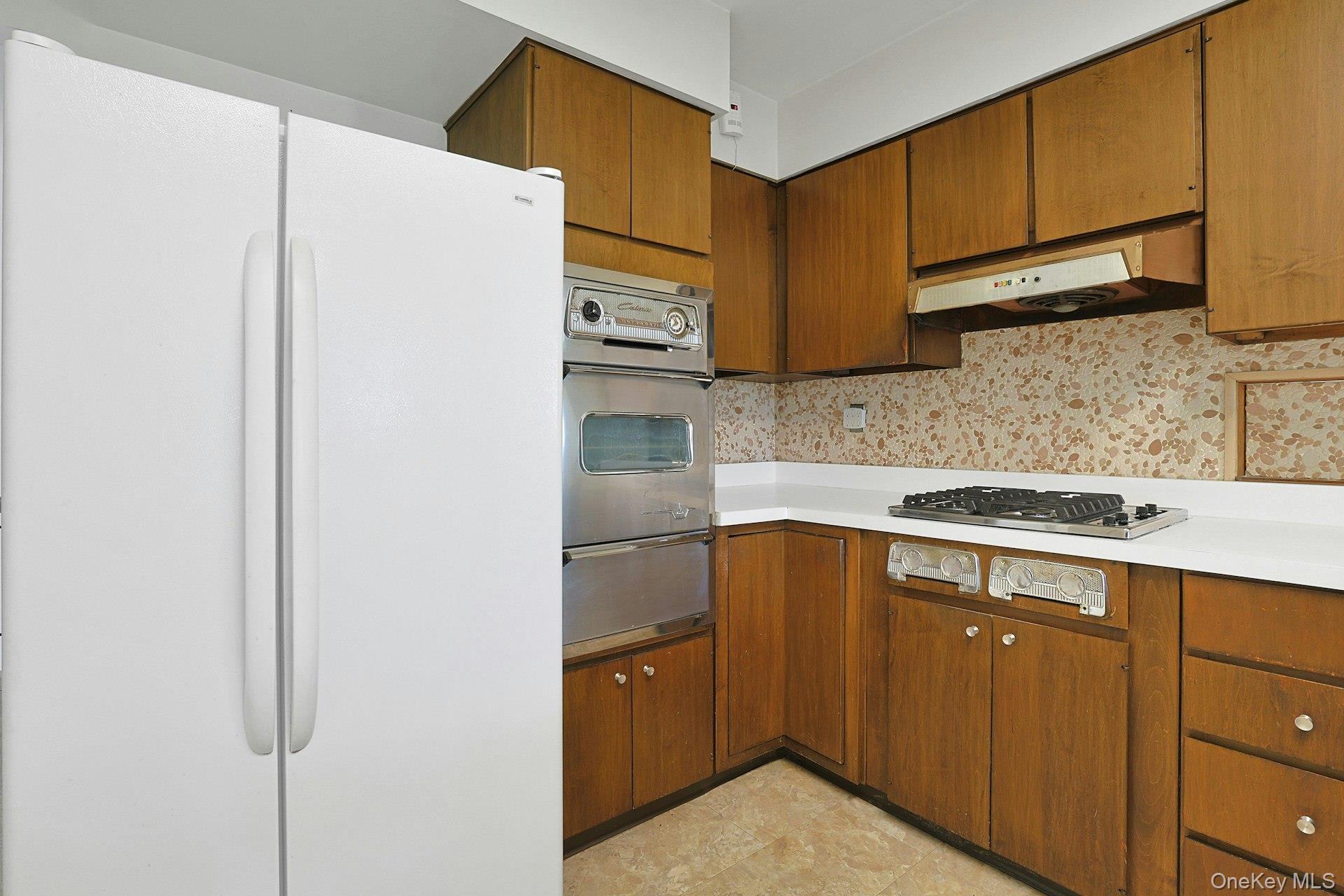 44 Southgate Drive Spring Valley, NY 10977 - Photo 9 of 24 a kitchen with stainless steel appliances granite countertop a sink stove and refrigerator