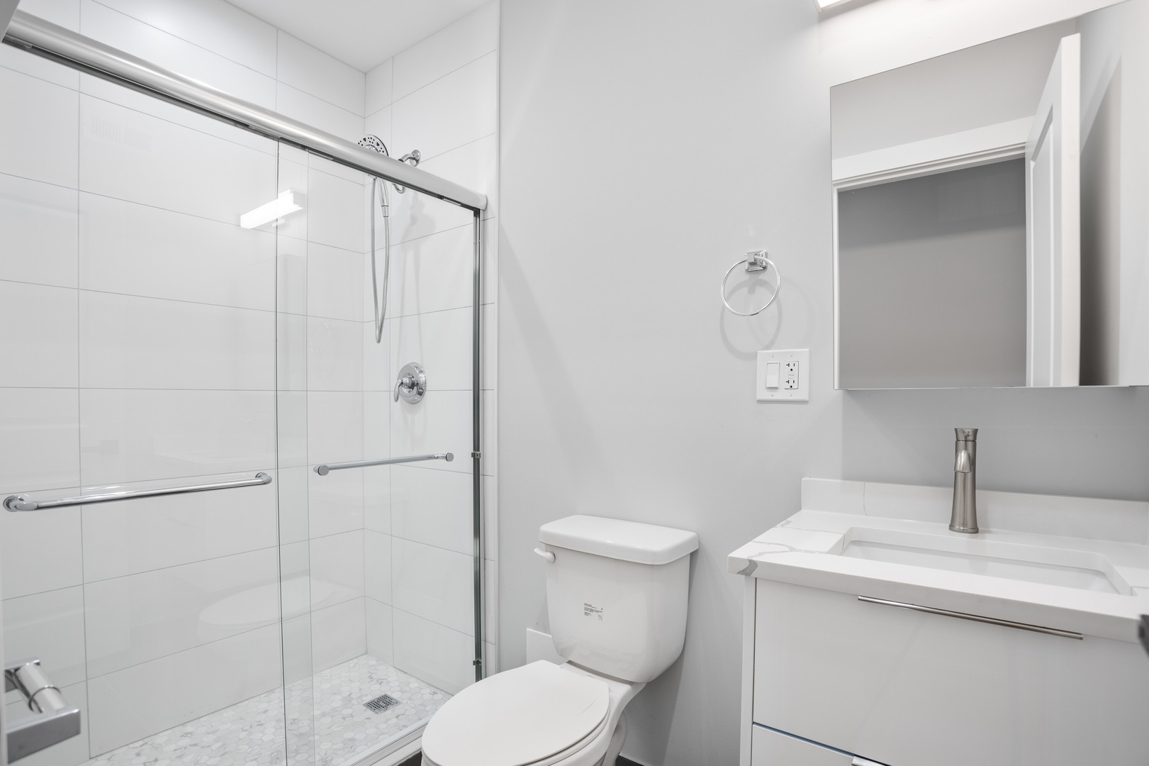 1554 West Juneway Terrace, Unit 3R Chicago, IL 60626 - Photo 8 of 8 a bathroom with a sink toilet and shower