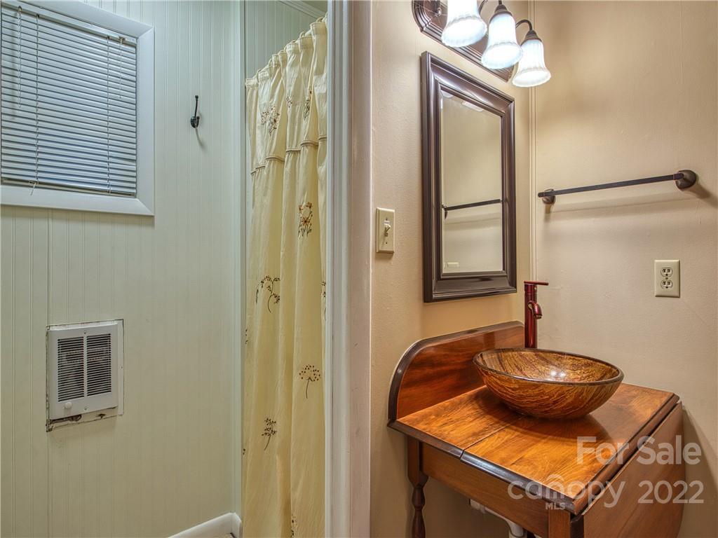 2660 Hemphill Road Waynesville, NC 28785 - Photo 27 of 43 a close view of a sink and dishwasher in a bathroom