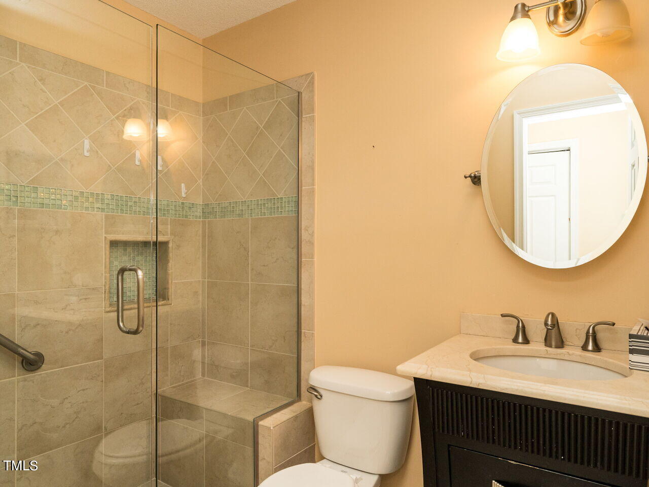 6822 Fairpoint Court Raleigh, NC 27613 - Photo 12 of 25 Master Bath updated with tile and walkin shower.