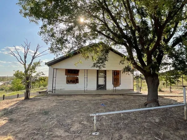 a house with trees in front of it