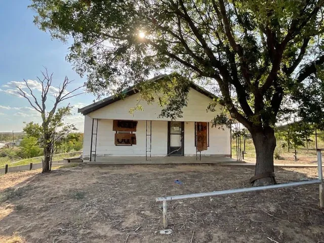 a house with trees in front of it