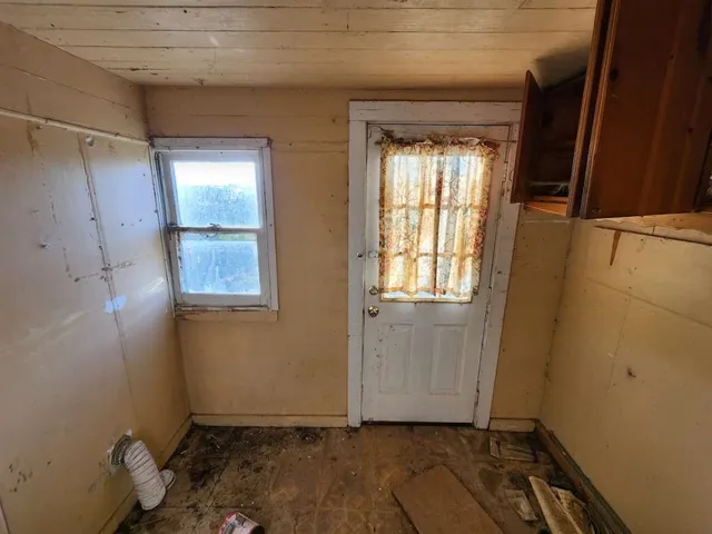 an empty room with windows