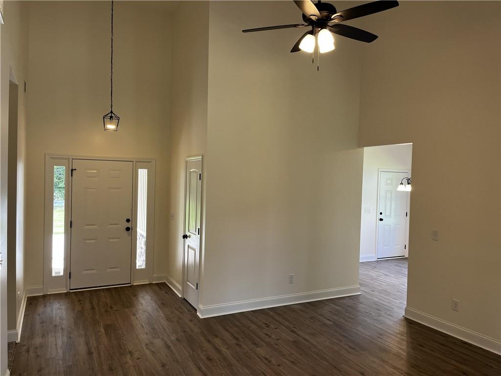 1932 Cochran Ridge Road Hiram, GA 30141 - Photo 14 of 30 an empty room with wooden floor and a ceiling fan