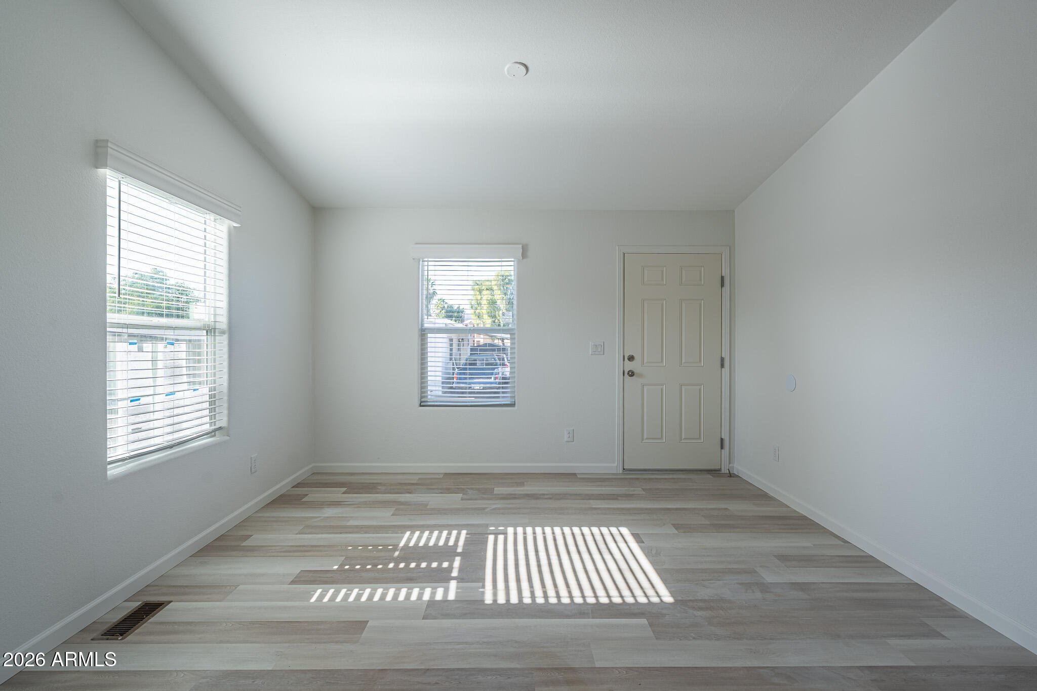 1250 East Bell Road, Unit 11 Phoenix, AZ 85022 - Photo 12 of 24 a view of an empty room with a window