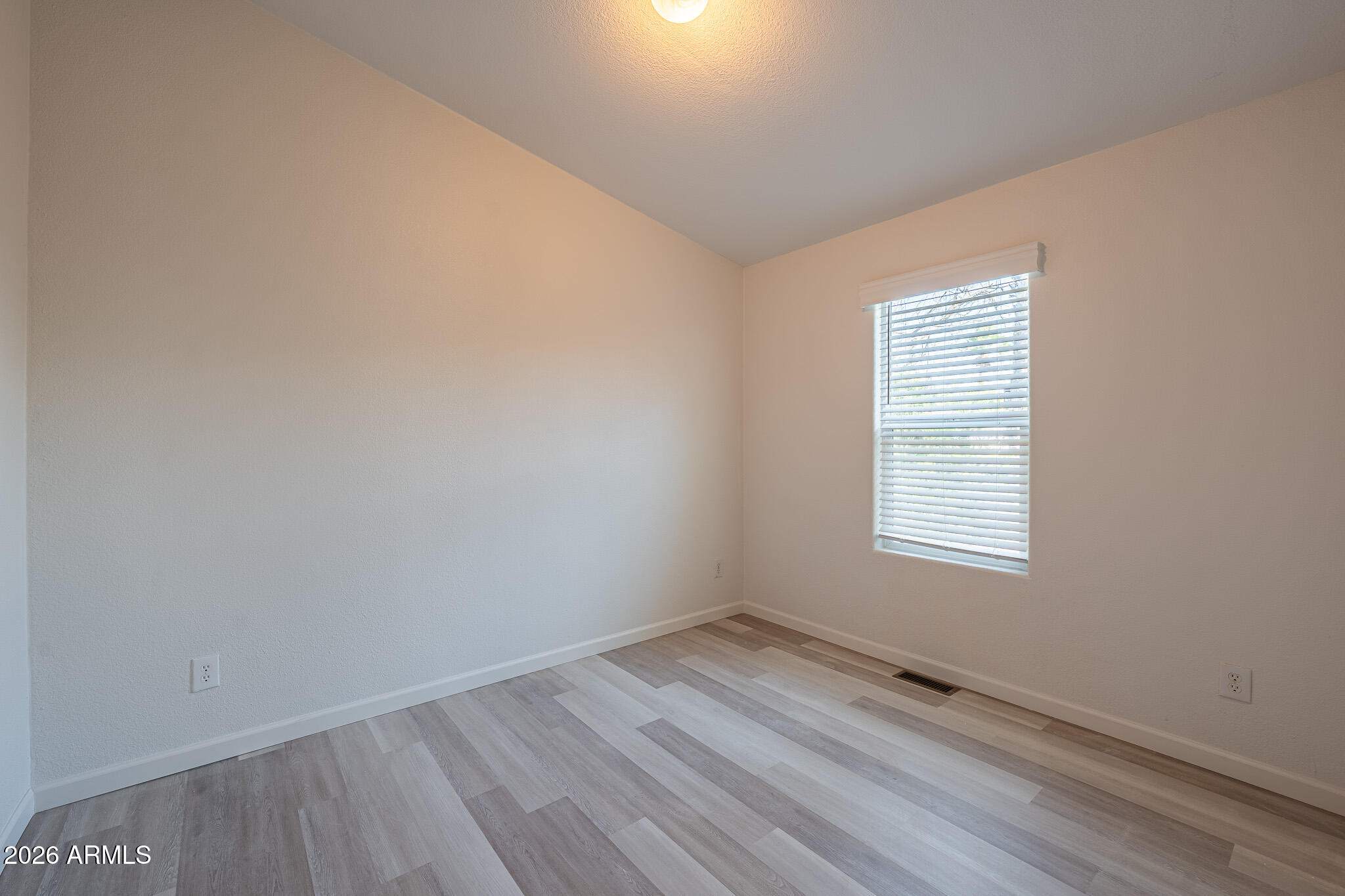 1250 East Bell Road, Unit 11 Phoenix, AZ 85022 - Photo 15 of 24 an empty room with a window