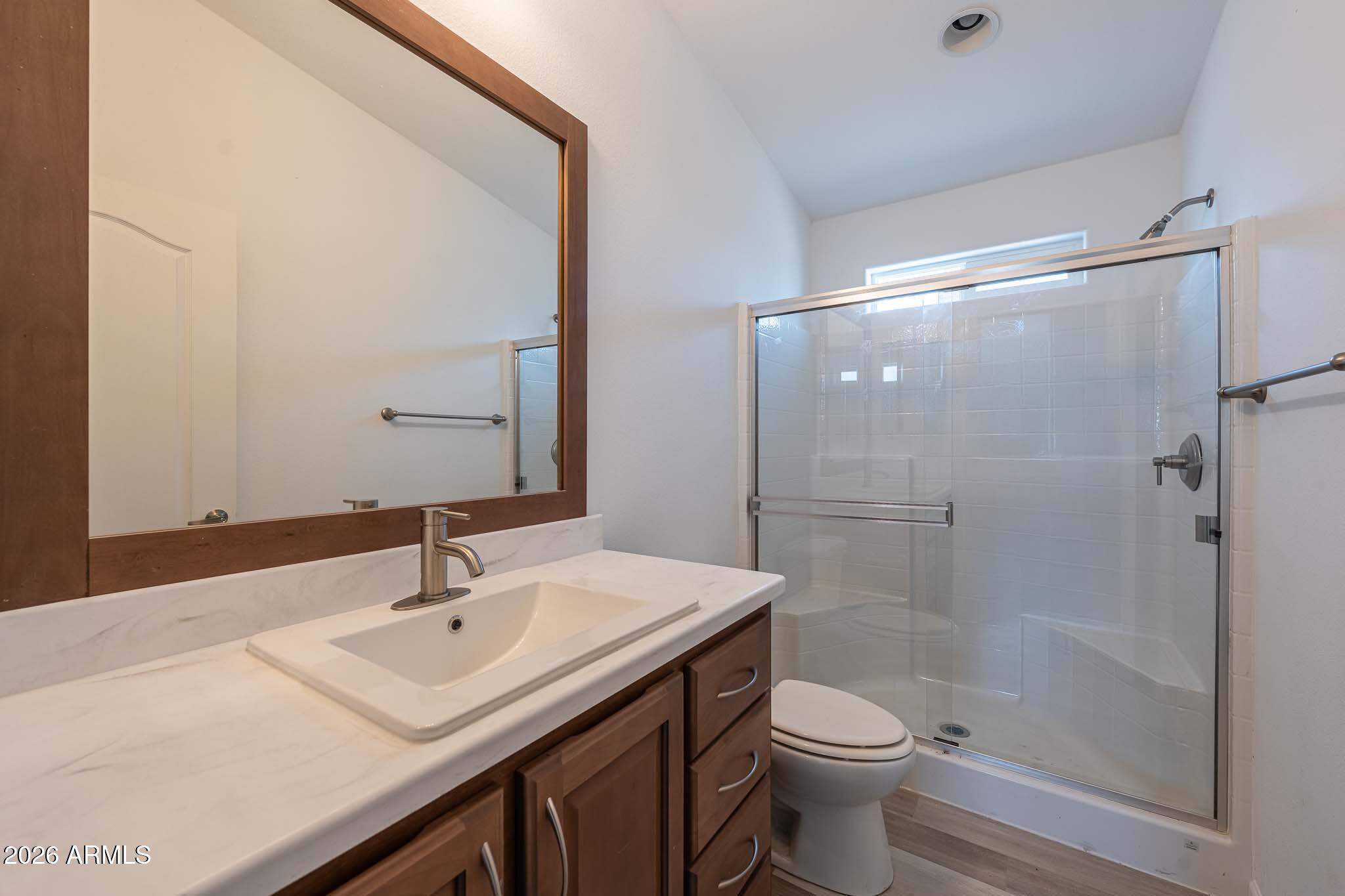1250 East Bell Road, Unit 11 Phoenix, AZ 85022 - Photo 16 of 24 a bathroom with a sink a toilet and shower