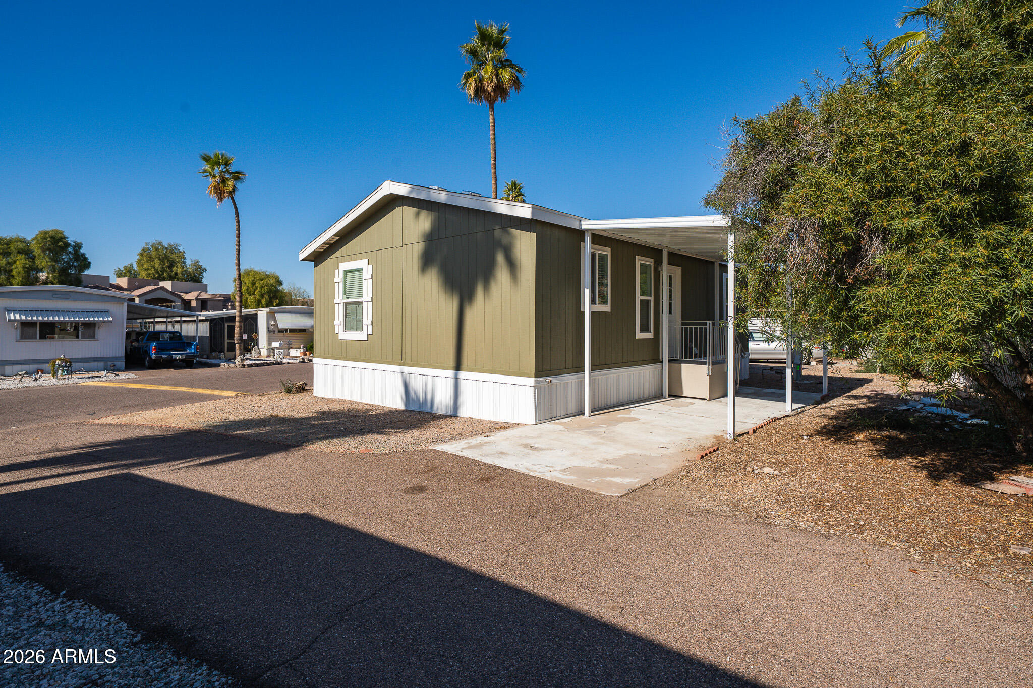 1250 East Bell Road, Unit 11 Phoenix, AZ 85022 - Photo 19 of 24 a front view of a house with a yard
