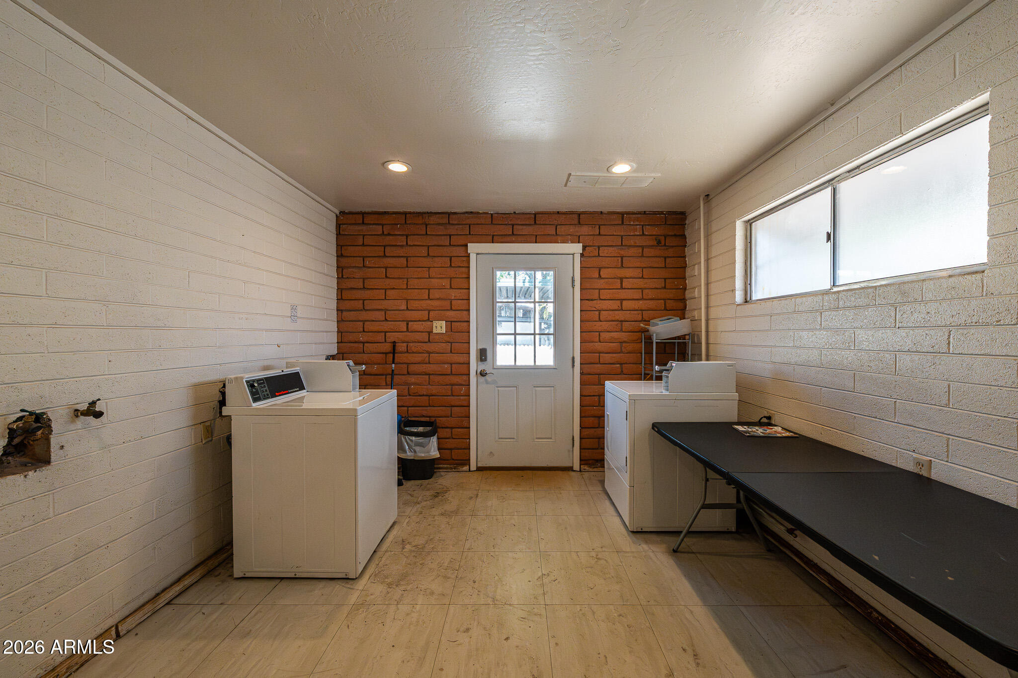 1250 East Bell Road, Unit 11 Phoenix, AZ 85022 - Photo 23 of 24 a view of a room with washer and dryer