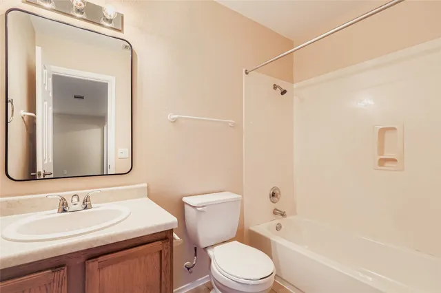 a bathroom with a toilet a sink and a bathtub