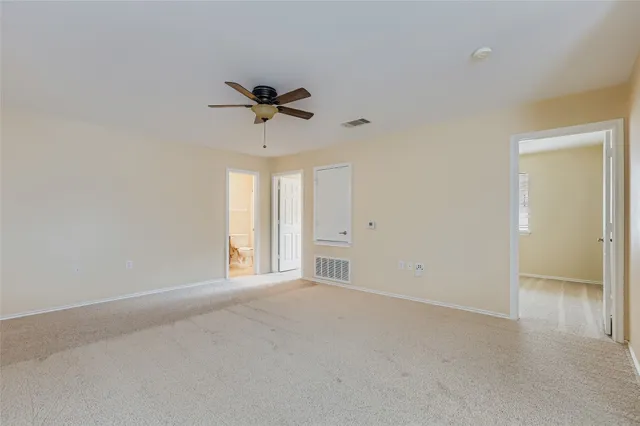 a view of an empty room and a window