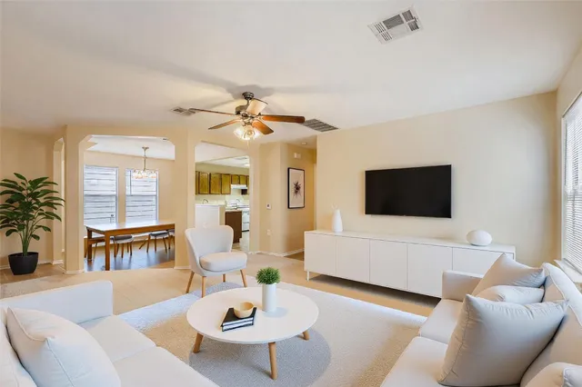 a living room with furniture and a flat screen tv