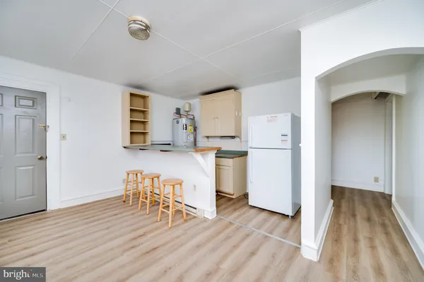 a kitchen with a table and chairs