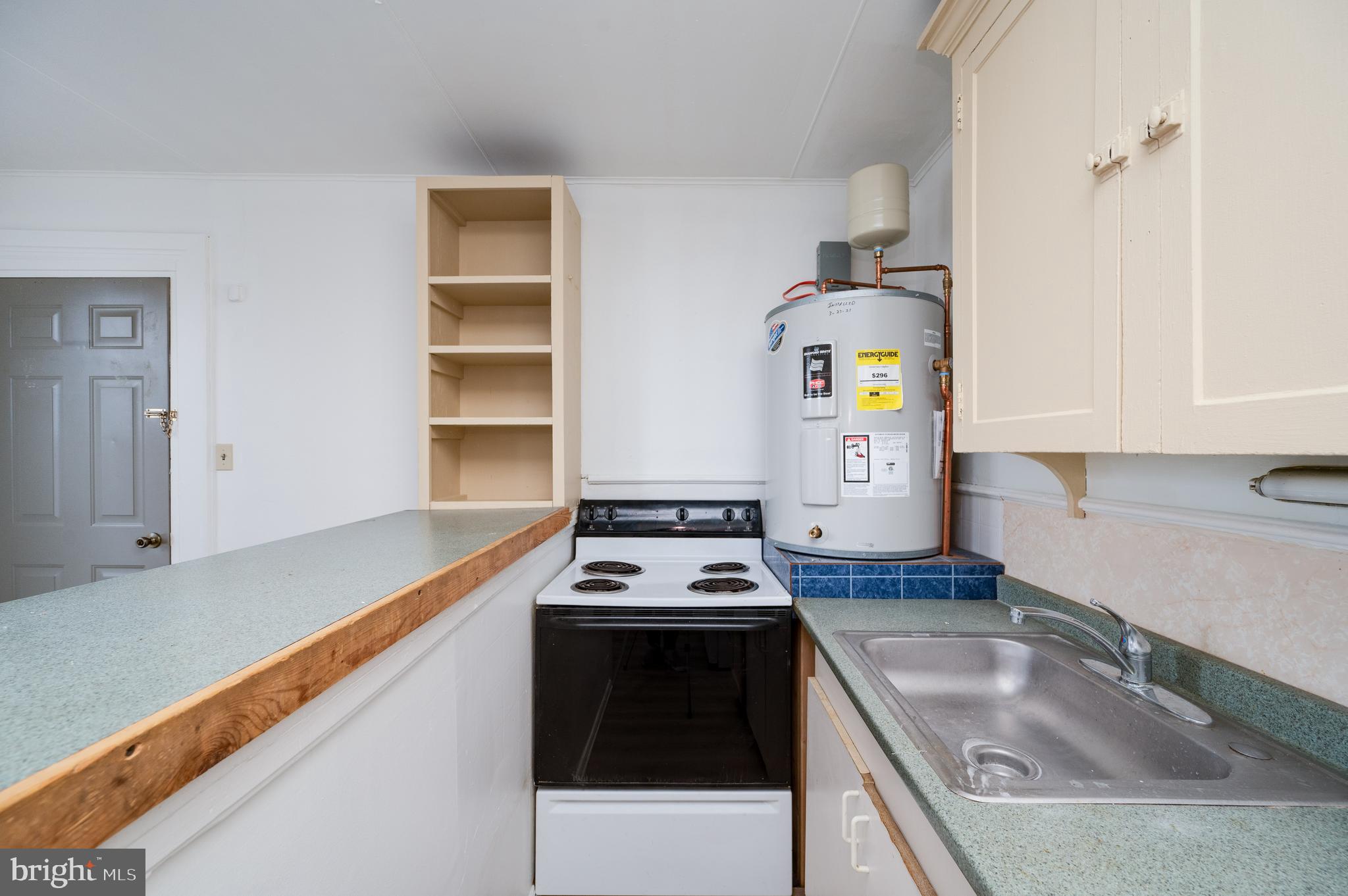 302-4 West Main Street Kutztown, PA 19530 - Photo 13 of 37 a kitchen with stainless steel appliances granite countertop a sink stove and refrigerator