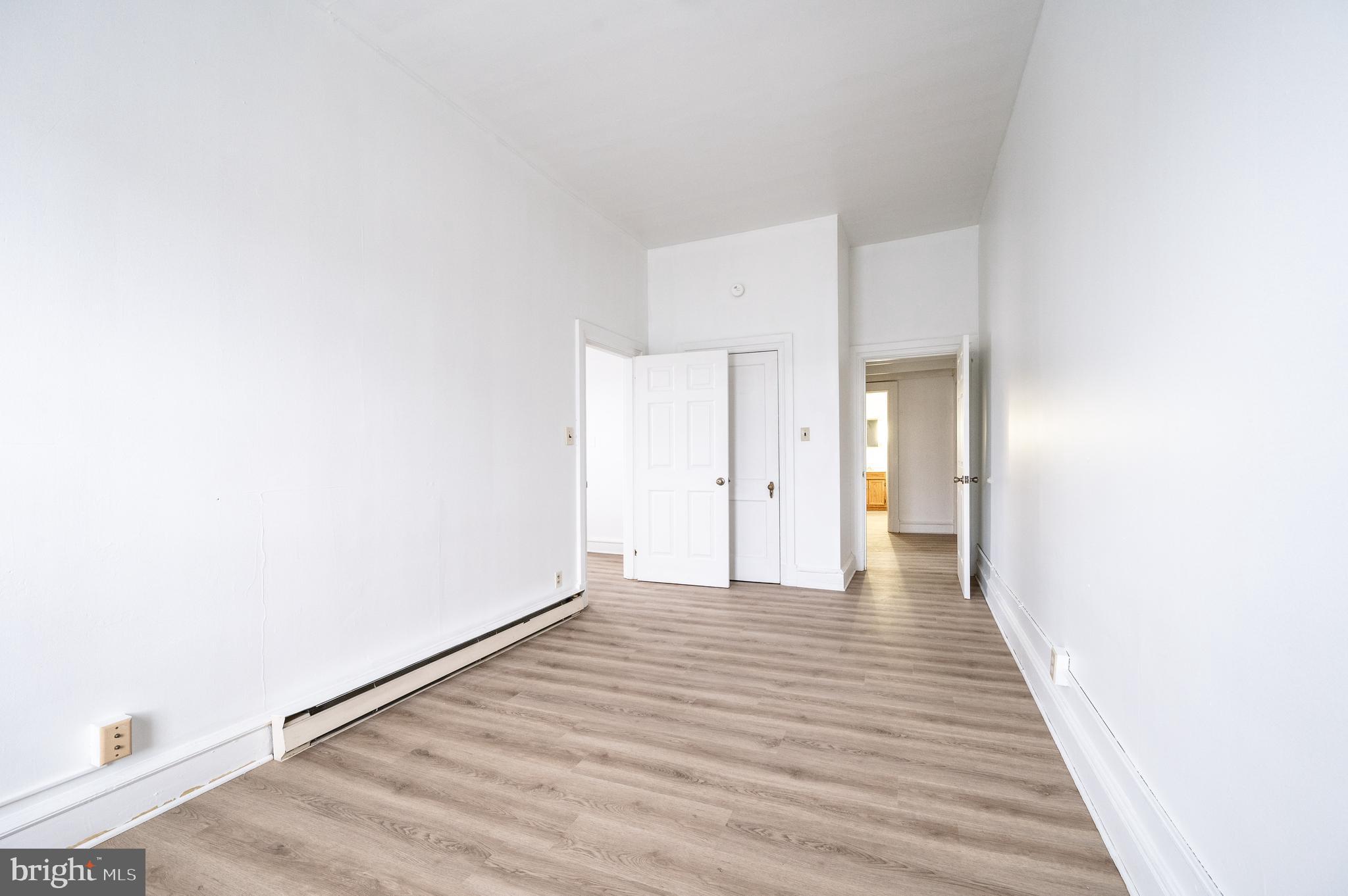 302-4 West Main Street Kutztown, PA 19530 - Photo 17 of 37 a view of an empty room with wooden floor