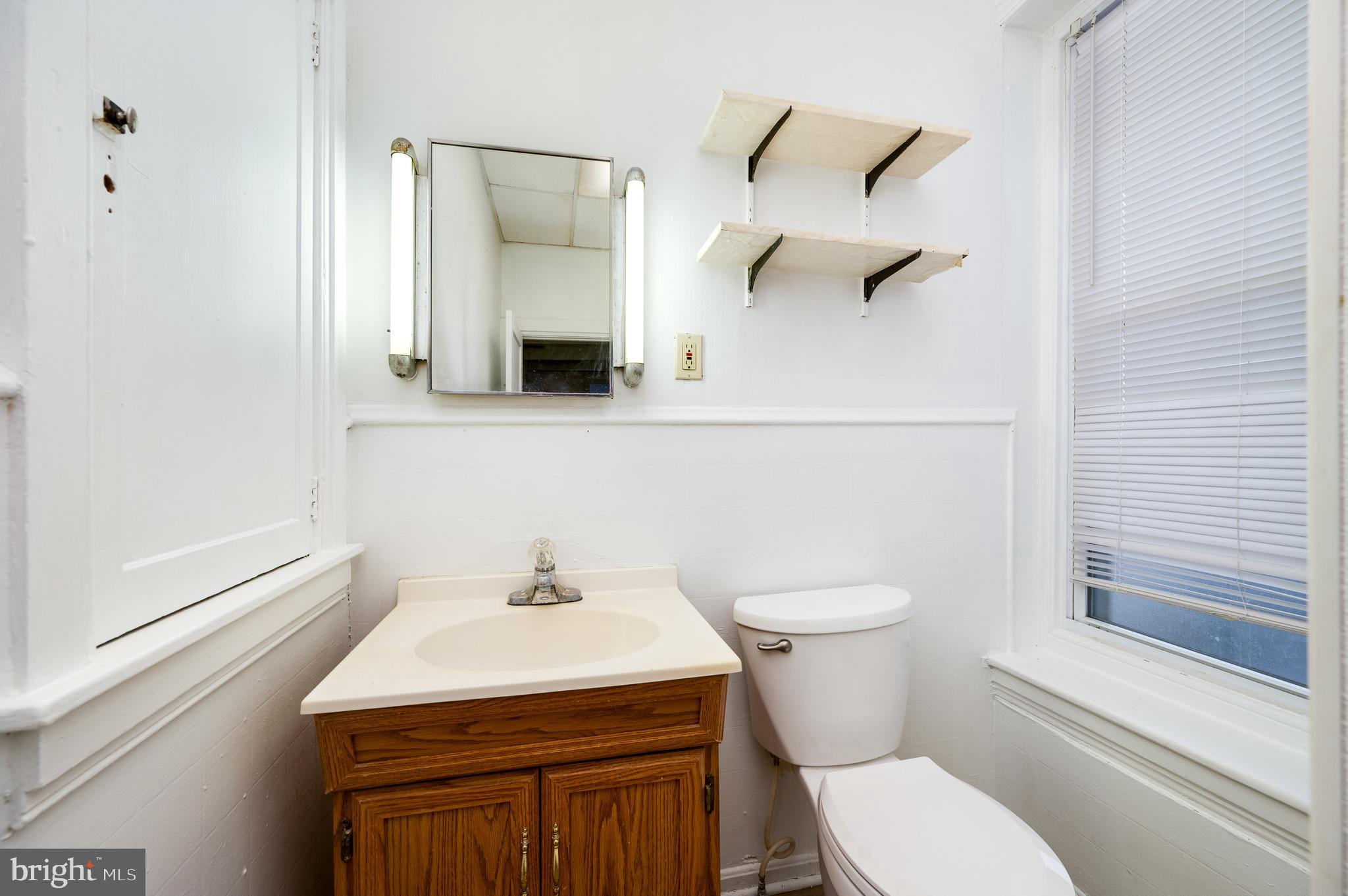 302-4 West Main Street Kutztown, PA 19530 - Photo 6 of 37 a bathroom with a sink a toilet and shower