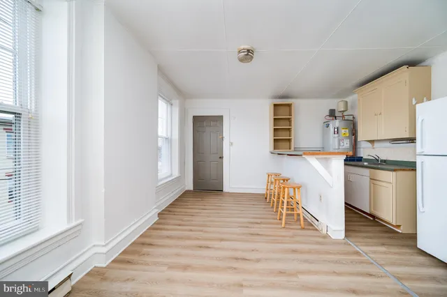 a view of a kitchen with an oven and cabinets