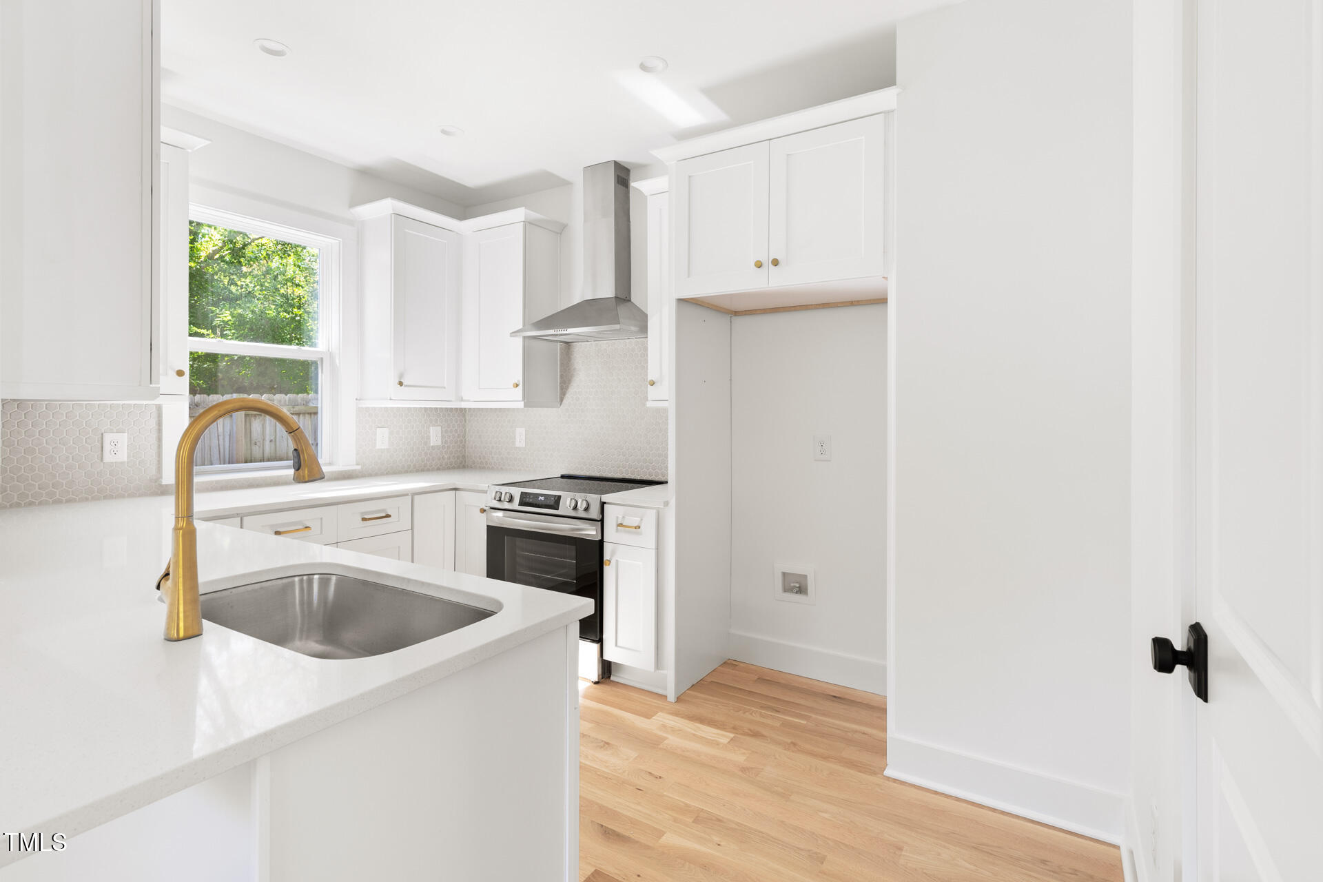 407 B Edward Street Durham, NC 27701 - Photo 11 of 39 a kitchen with granite countertop a sink stove and refrigerator