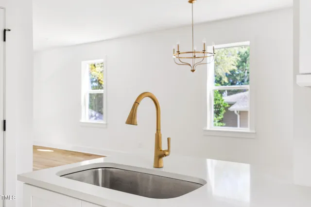 a kitchen with a window a sink and a window