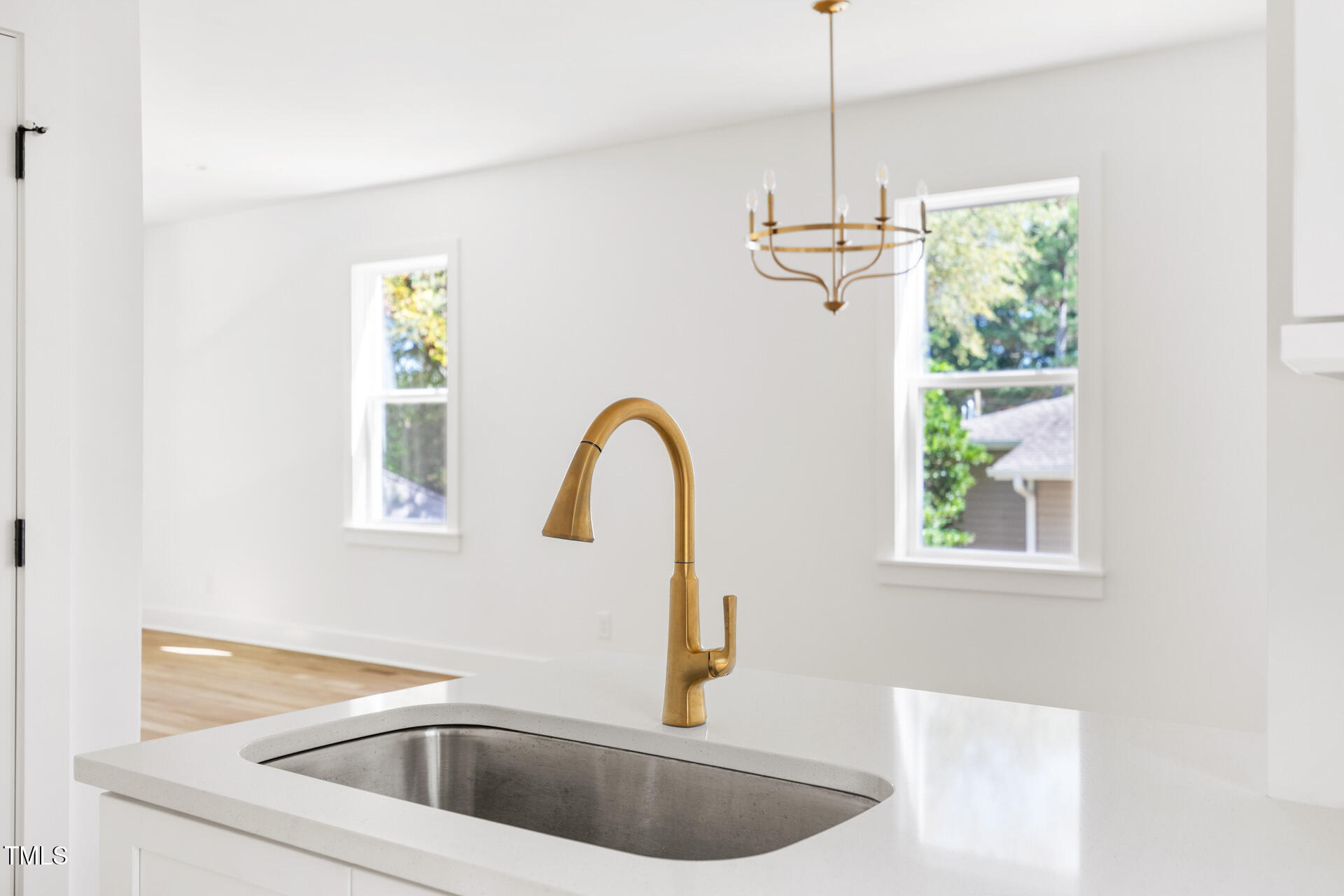 407 B Edward Street Durham, NC 27701 - Photo 15 of 39 a kitchen with a window a sink and a window