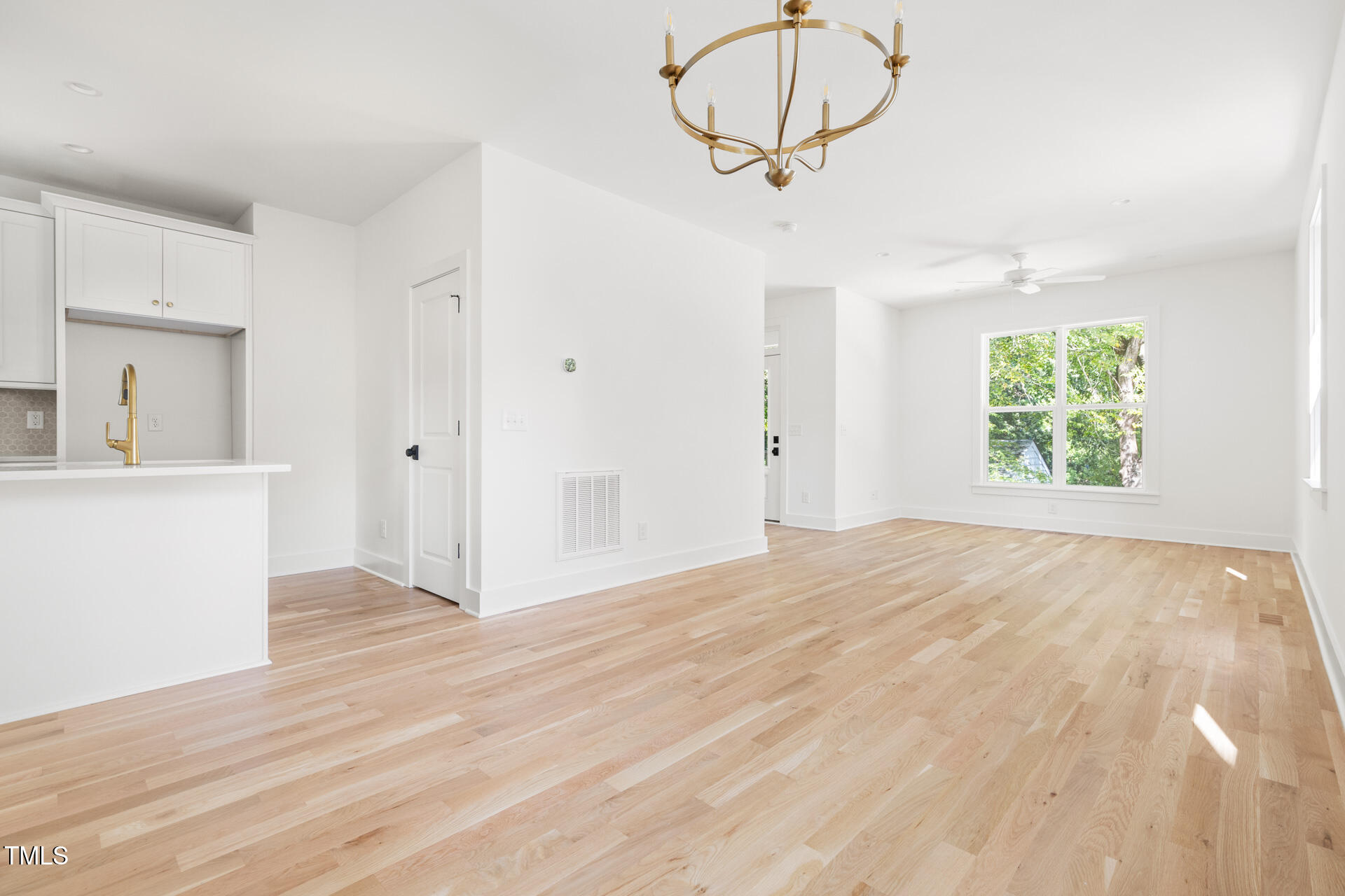 407 B Edward Street Durham, NC 27701 - Photo 17 of 39 a view of an empty room with a window and wooden floor