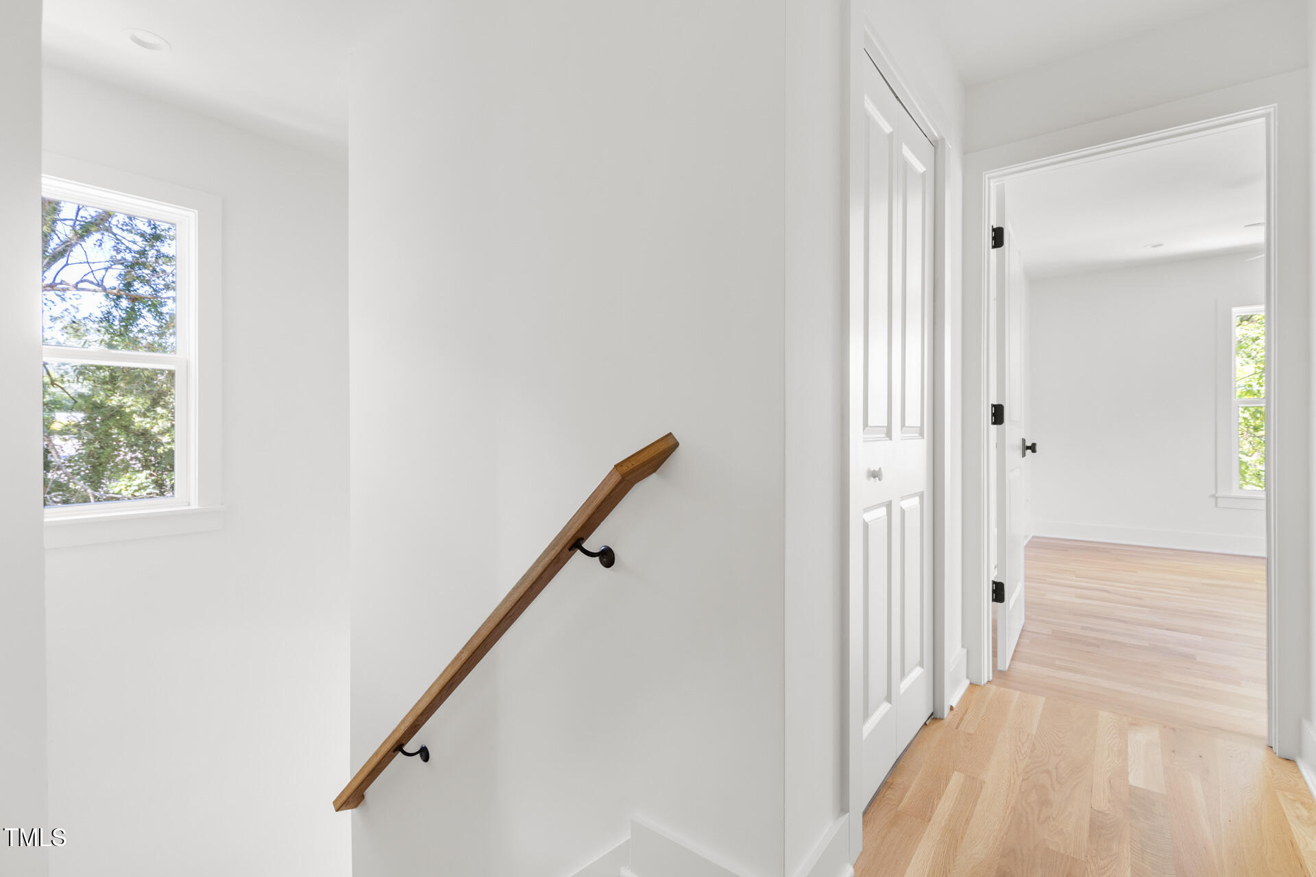 407 B Edward Street Durham, NC 27701 - Photo 20 of 39 a view of a hallway with wooden floor and staircase