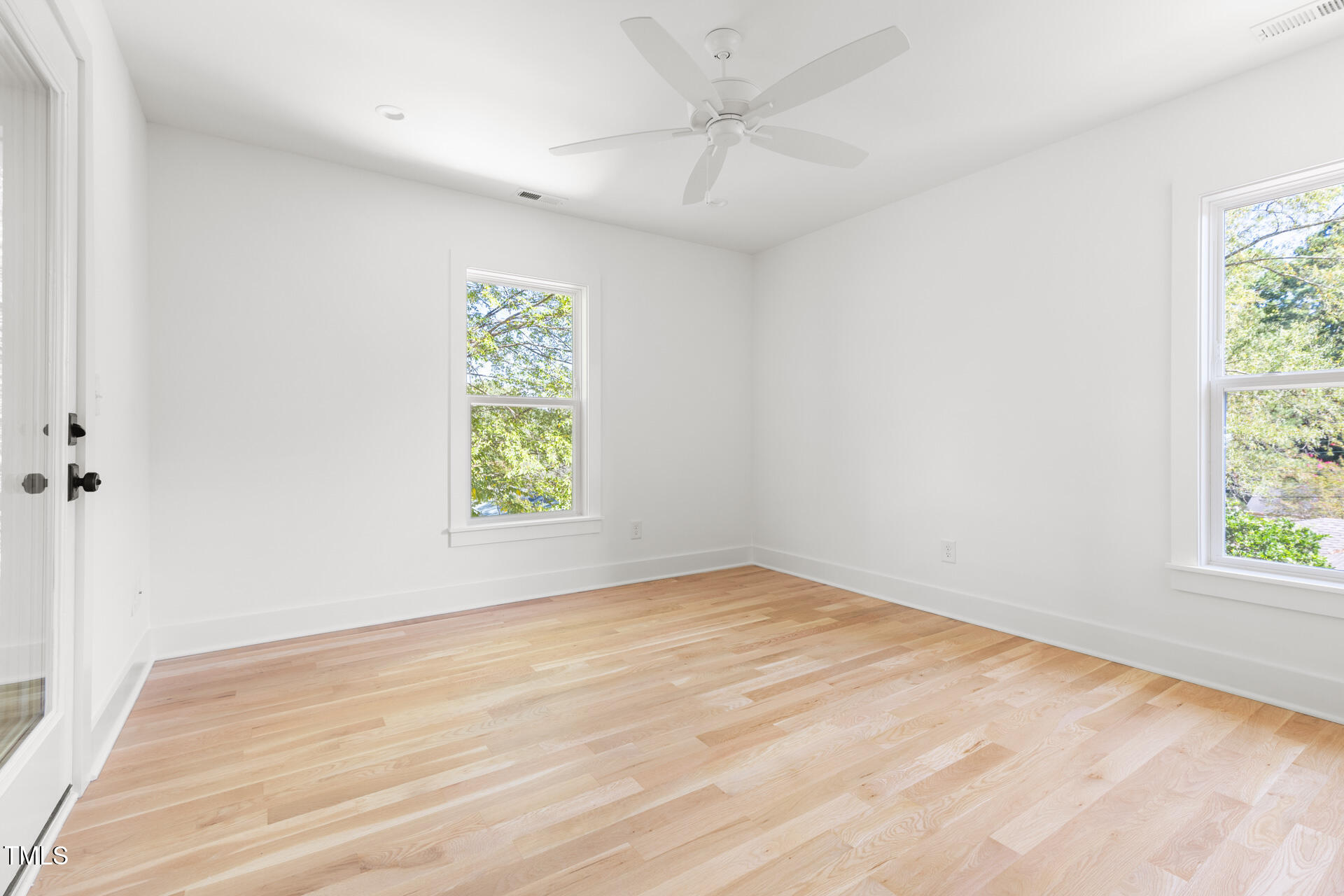 407 B Edward Street Durham, NC 27701 - Photo 21 of 39 a view of an empty room with a window