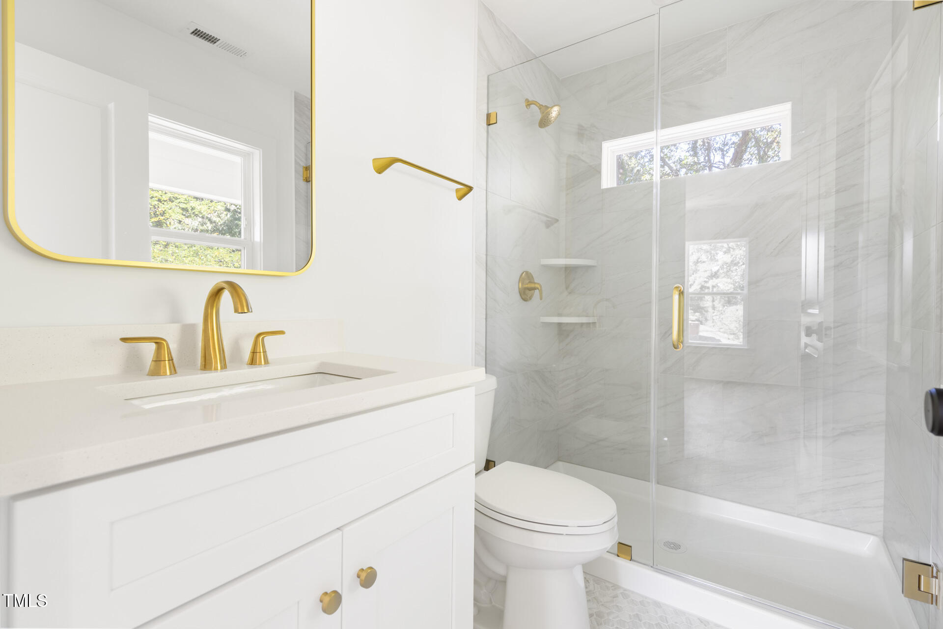 407 B Edward Street Durham, NC 27701 - Photo 24 of 39 a bathroom with a sink toilet and shower