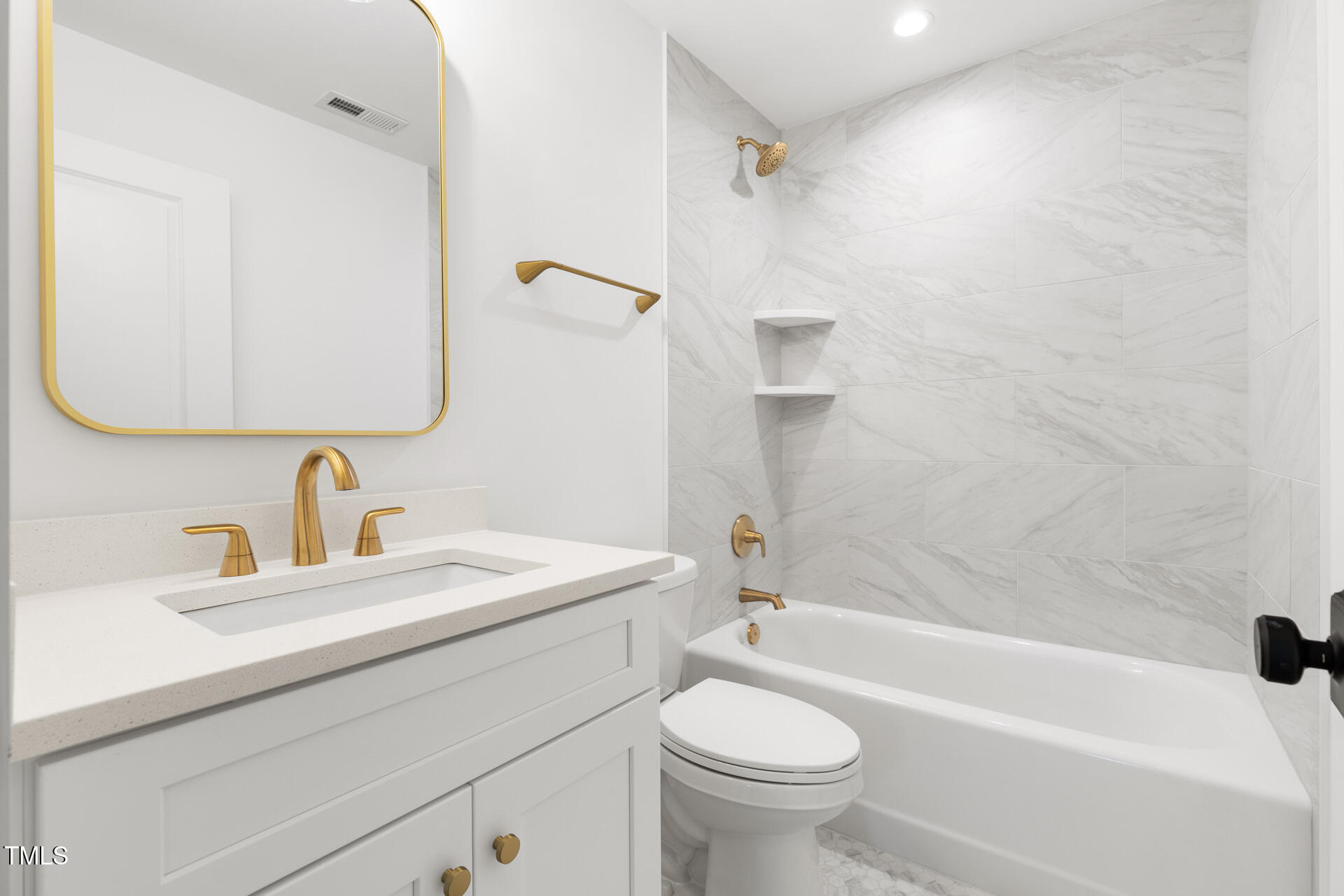 407 B Edward Street Durham, NC 27701 - Photo 29 of 39 a bathroom with a sink a toilet and a bathtub