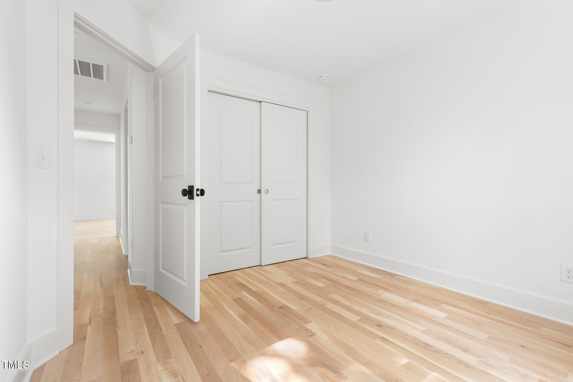 407 B Edward Street Durham, NC 27701 - Photo 30 of 39 a view of a room with wooden floor and closet