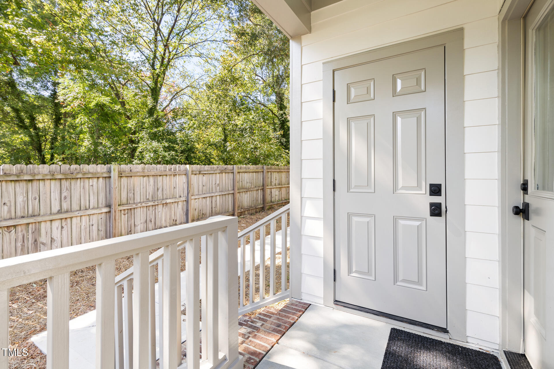 407 B Edward Street Durham, NC 27701 - Photo 33 of 39 a view of a porch with wooden floor and fence