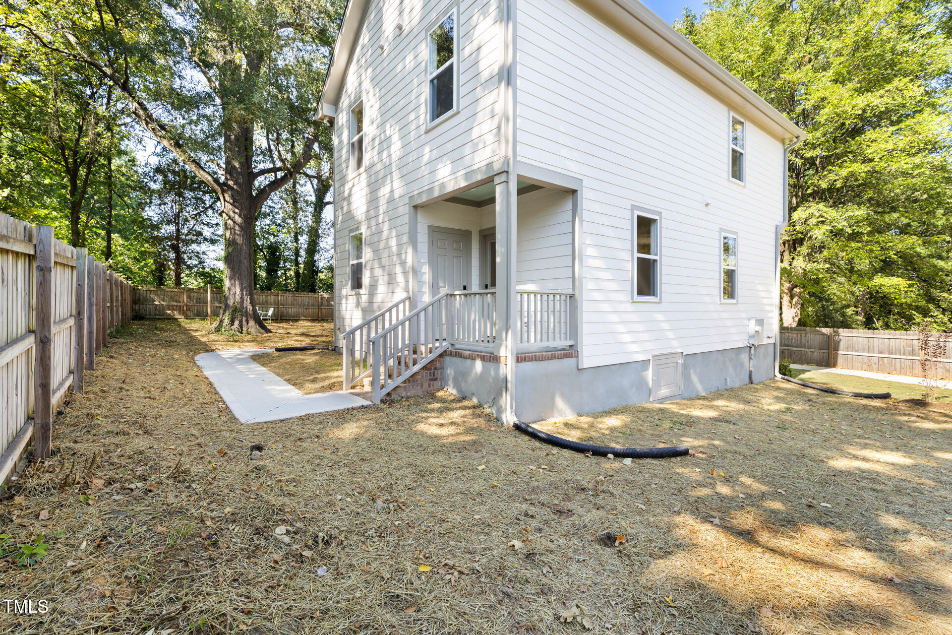 407 B Edward Street Durham, NC 27701 - Photo 34 of 39 a view of a house with backyard and trees