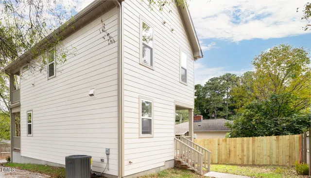 a view of backyard with patio