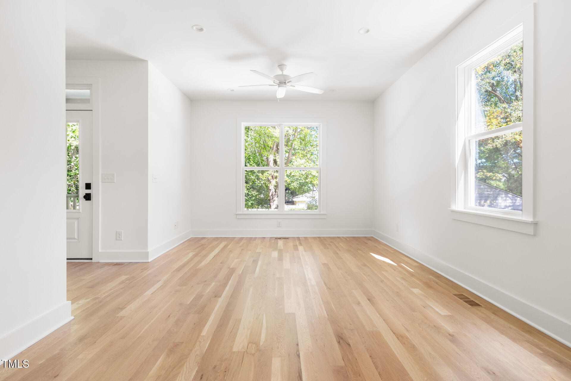 407 B Edward Street Durham, NC 27701 - Photo 7 of 39 wooden floor in an empty room with a window