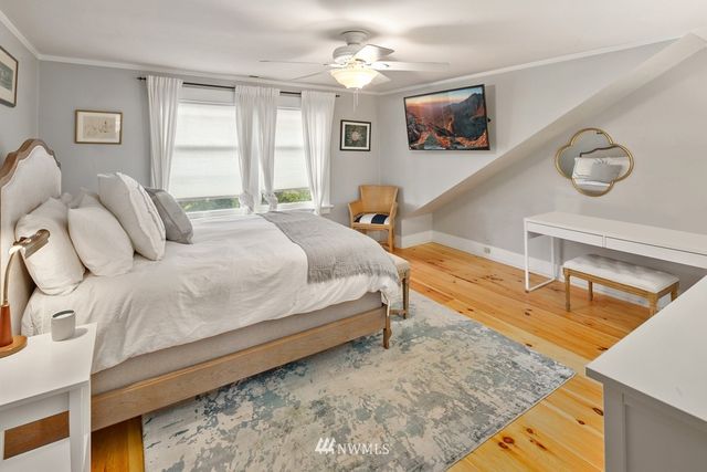 a spacious bedroom with a bed and window