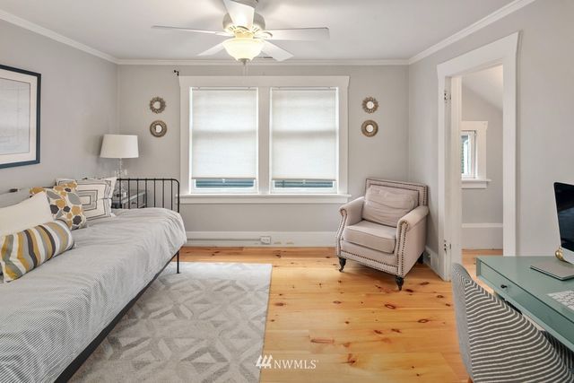 a spacious bedroom with a bed and a couch