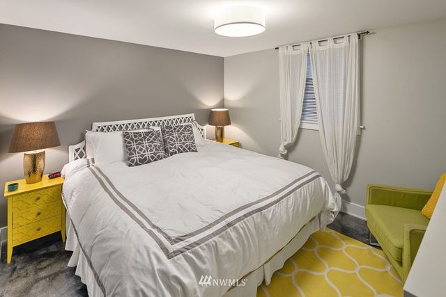 a bedroom with a bed and a couch