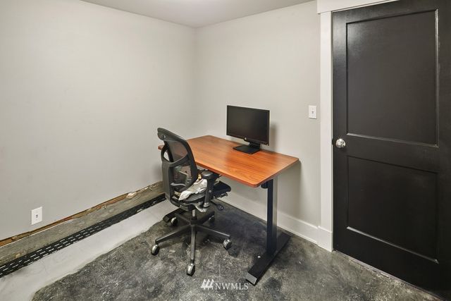 a view of a workspace with furniture
