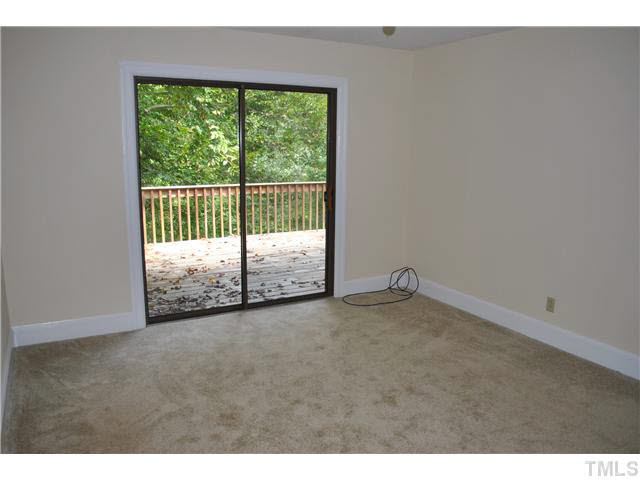 610 Buffaloe Road Garner, NC 27529 - Photo 23 of 25 a view of an empty room with wooden floor