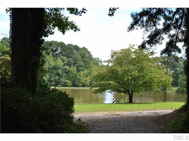 610 Buffaloe Road Garner, NC 27529 - Photo 9 of 25 a view of grassy field with trees