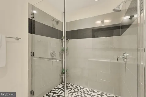 a bathroom with a shower and a shower