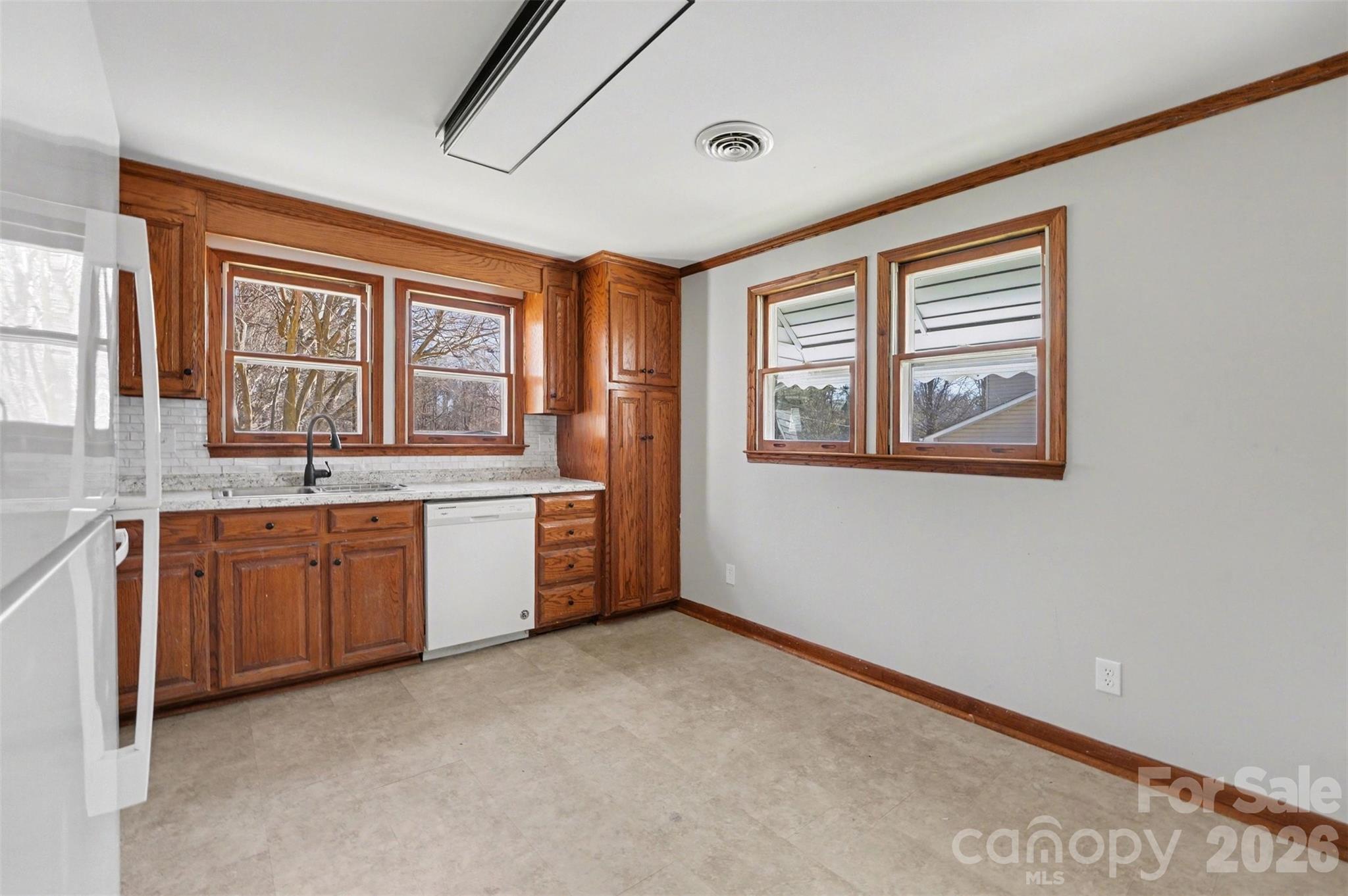 1440 Majolica Road Salisbury, NC 28147 - Photo 11 of 25 a big room with windows and cabinet