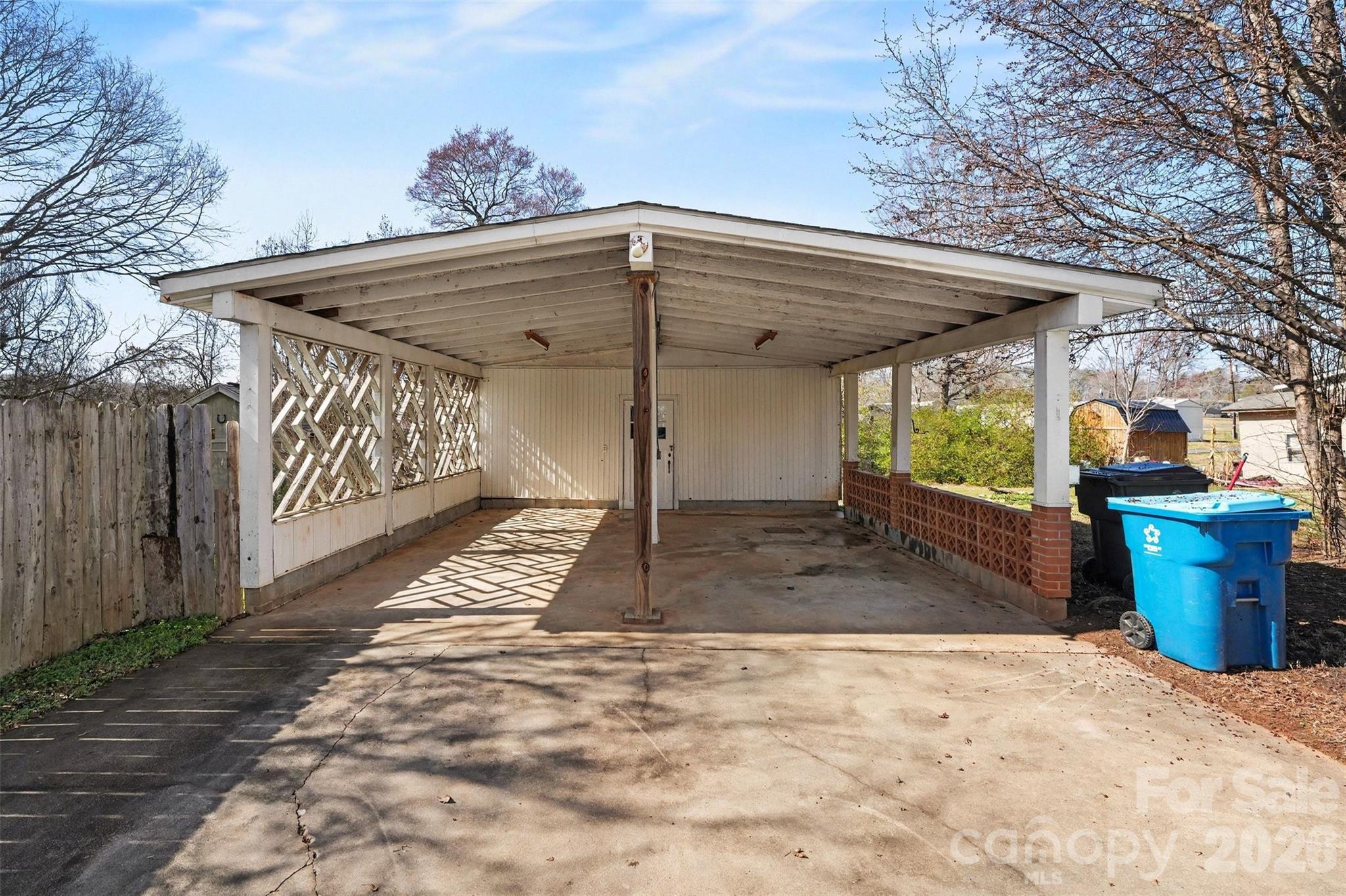 1440 Majolica Road Salisbury, NC 28147 - Photo 3 of 25 a view of a backyard space with wooden fence