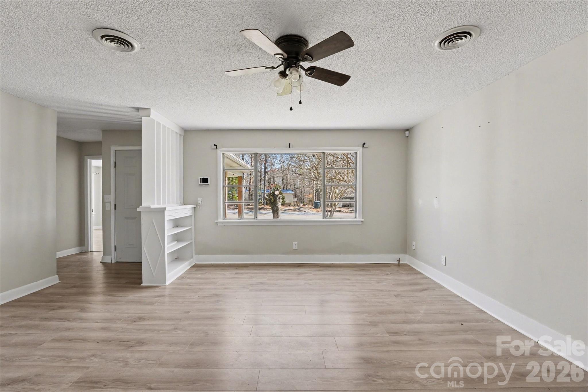 1440 Majolica Road Salisbury, NC 28147 - Photo 4 of 25 wooden floor in an empty room with a window