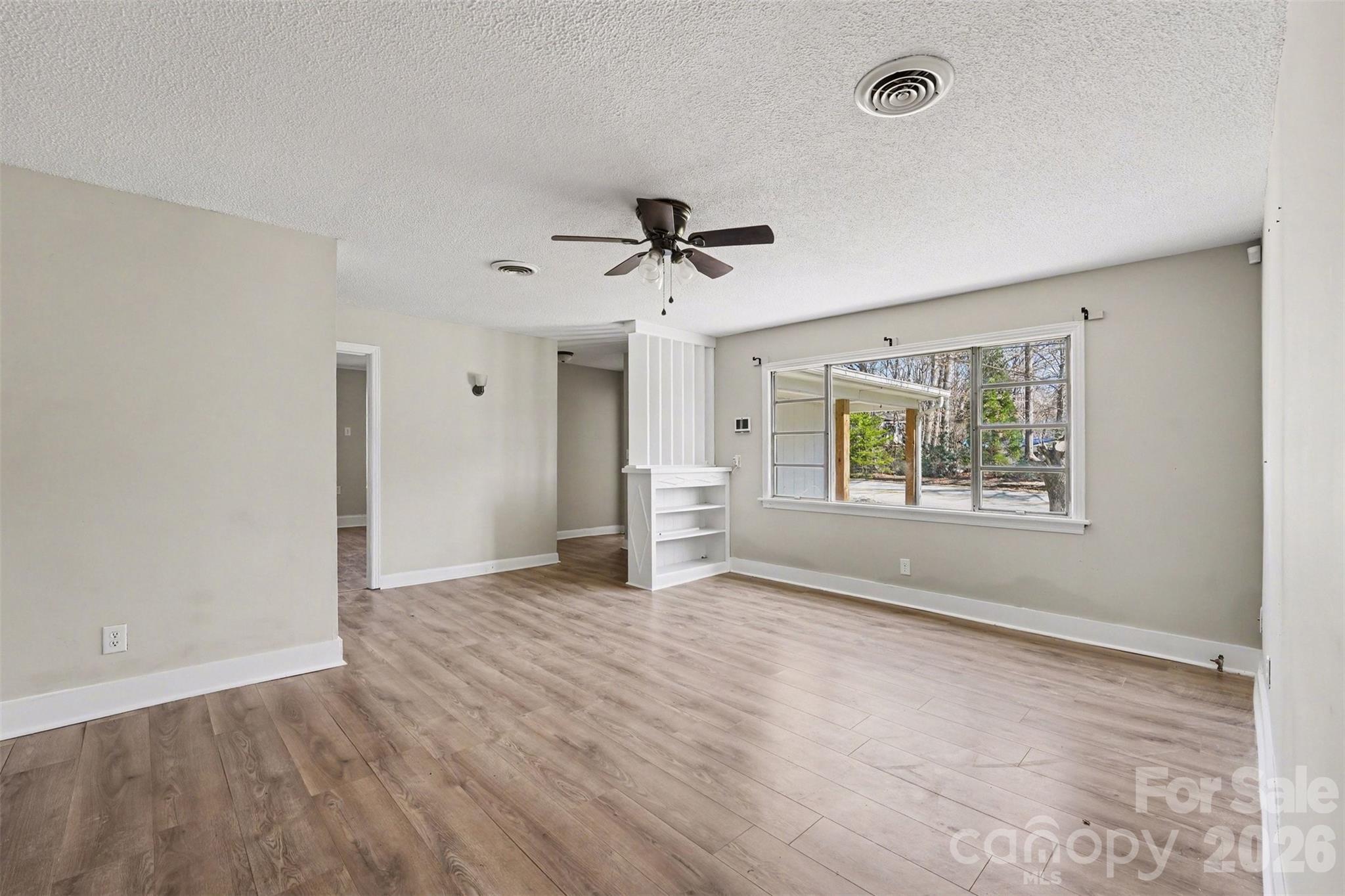 1440 Majolica Road Salisbury, NC 28147 - Photo 6 of 25 an empty room with fan and windows